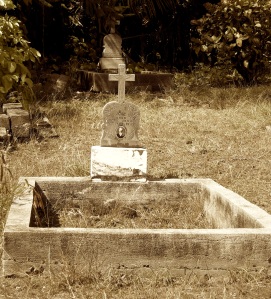 1920's Tombstone at St. Raphael Church in Koloa, Hawaii, the oldest church in Kauai.